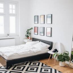 black platform bed with white mattress inside bedroom