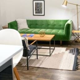 green sofa beside white table