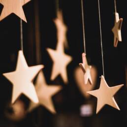 shallow focus photo of wooden stars hanging decor