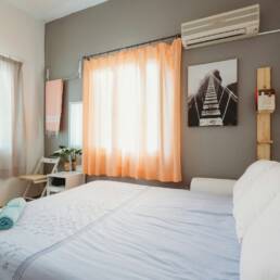 white bedspread inside room